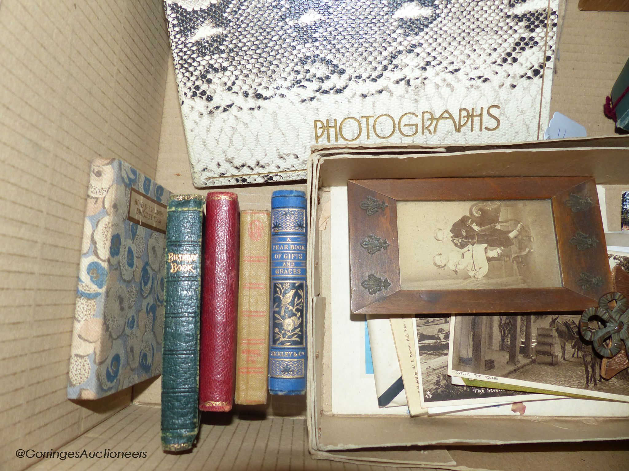 A collection of photograph albums and photos from late 19th century and two postcard albums